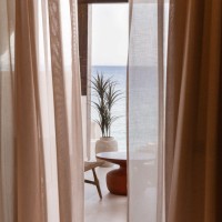 Contextual Reuse: Transforming a Coastal Shell into Seaside Suites